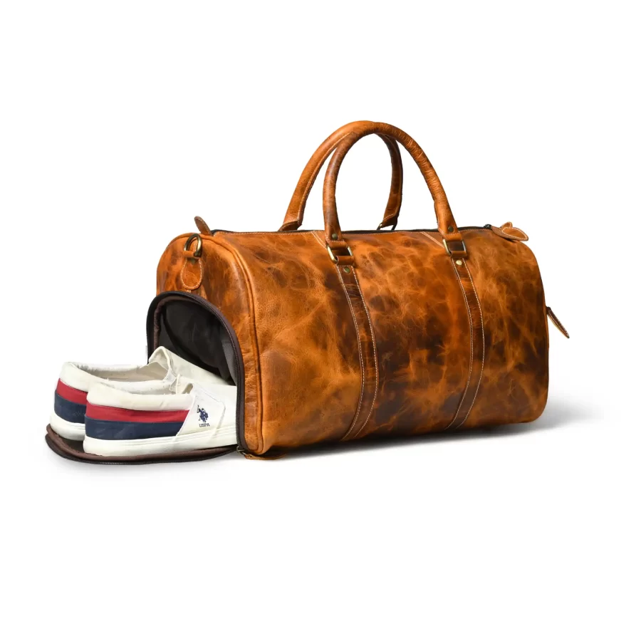 Pocket view of a tan brown duffle bag for shoes and other items