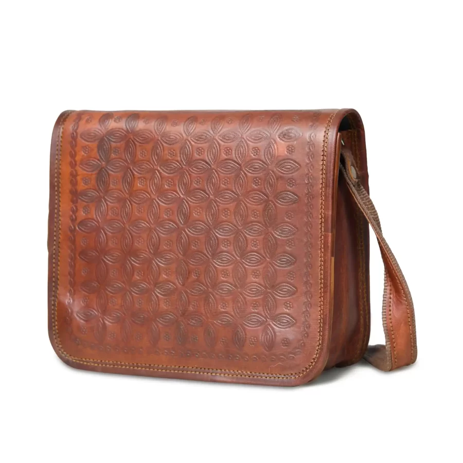 Side view of a brown full flap sling bag in square shape 2.