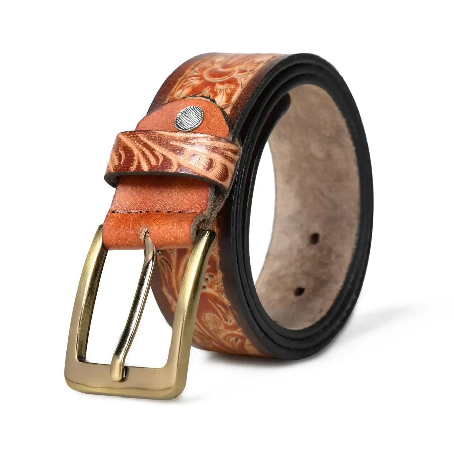 Light brown leather belt rolled up with buckle.