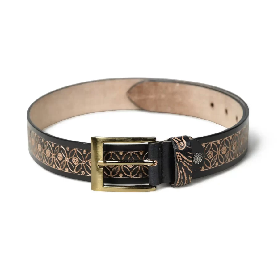 Full view of black leather belt with floral pattern.