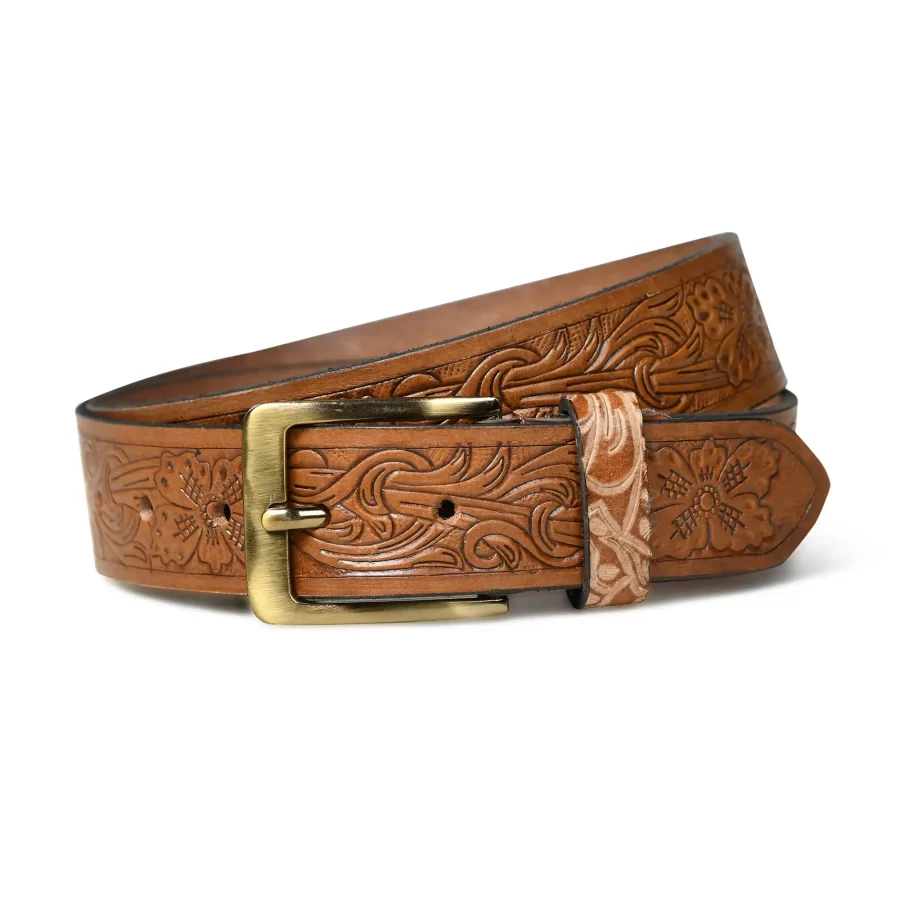 Close-up of tan brown leather belt with floral pattern