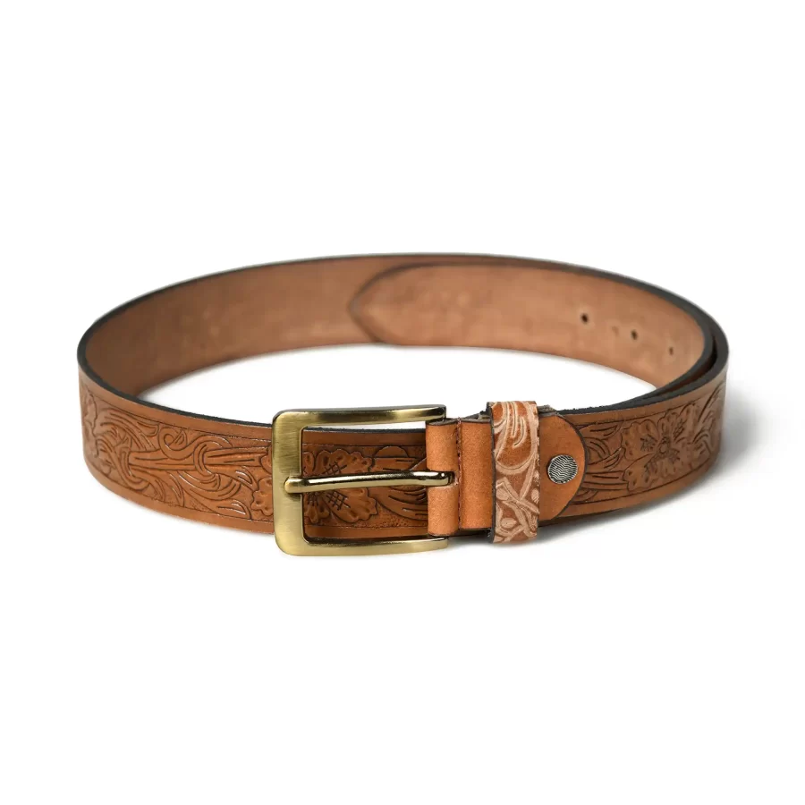 Full view of tan brown leather belt with floral pattern.