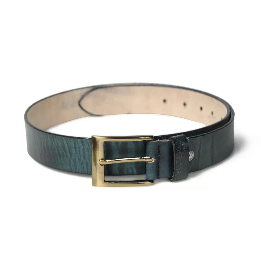 Full view of green leather belt for men laid flat. Full view of the green belt displayed flat.