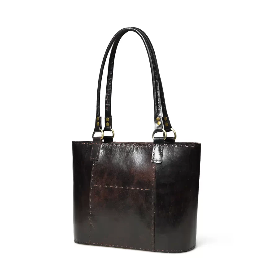 Side panel view of a dark brown leather tote bag 2