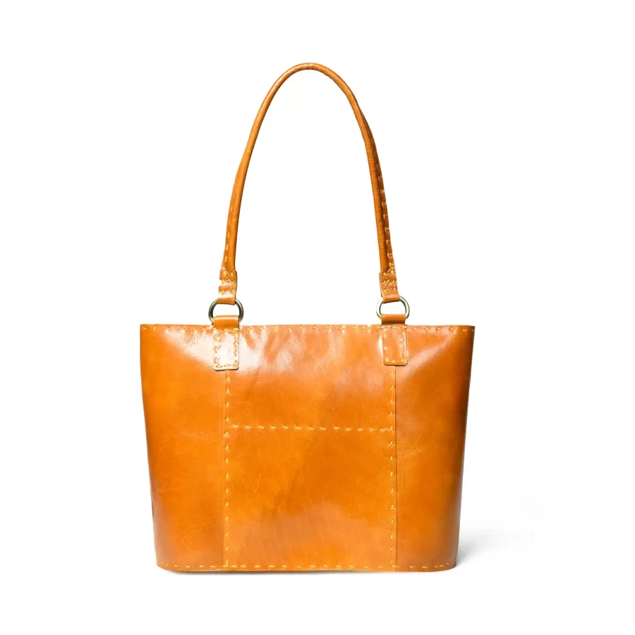 Front view of a mustard yellow leather tote bag 1