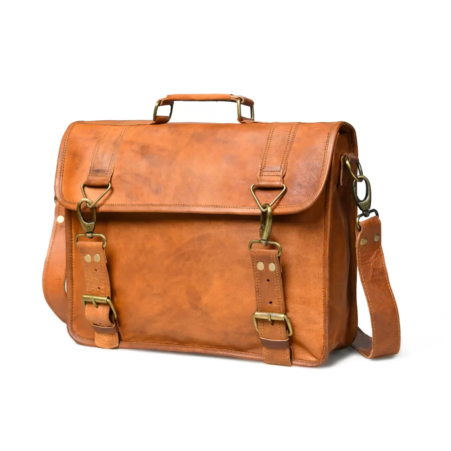 Side view of a tan brown leather messenger with satchel