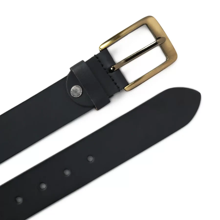 Front and backside of white and grey handmade leather polo belt.