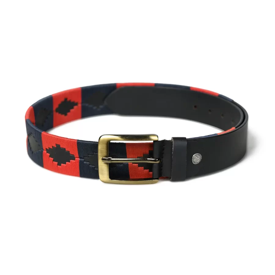 Full view of dark blue and red handmade leather polo belt laid flat.