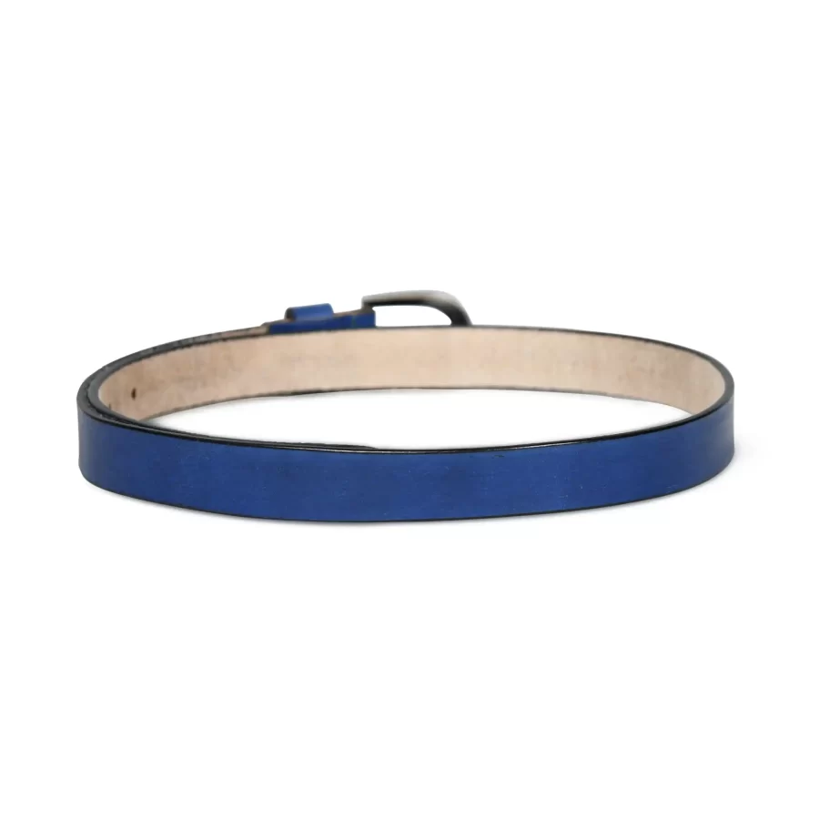 Text: Dark blue leather belt worn with light jeans