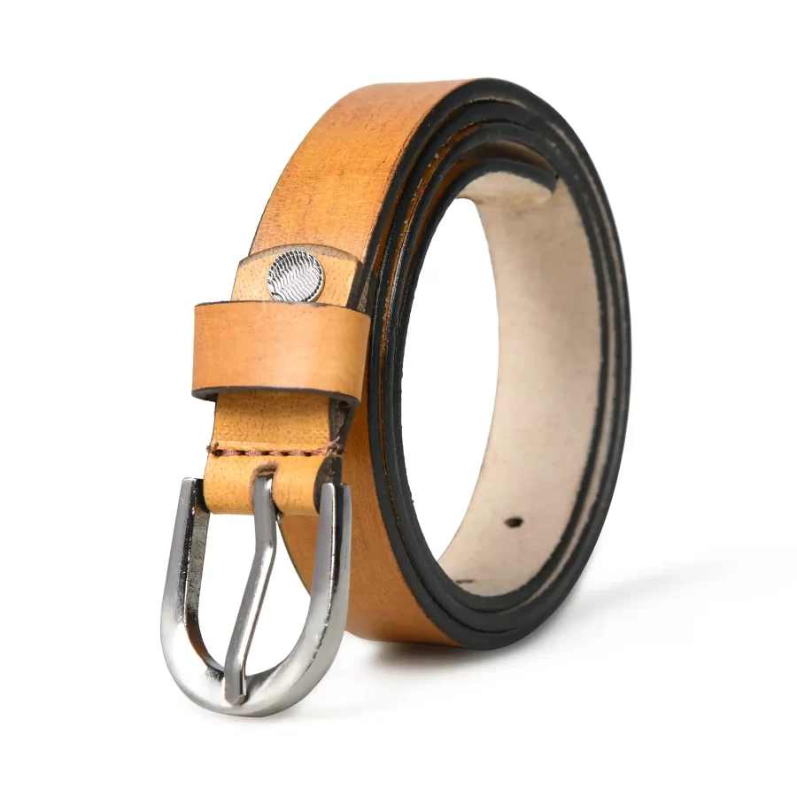 Tan brown leather belt rolled up with the front side and buckle visible