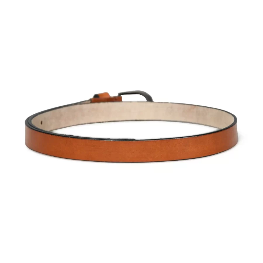 Backside of the light brown leather belt showing the reverse side material.