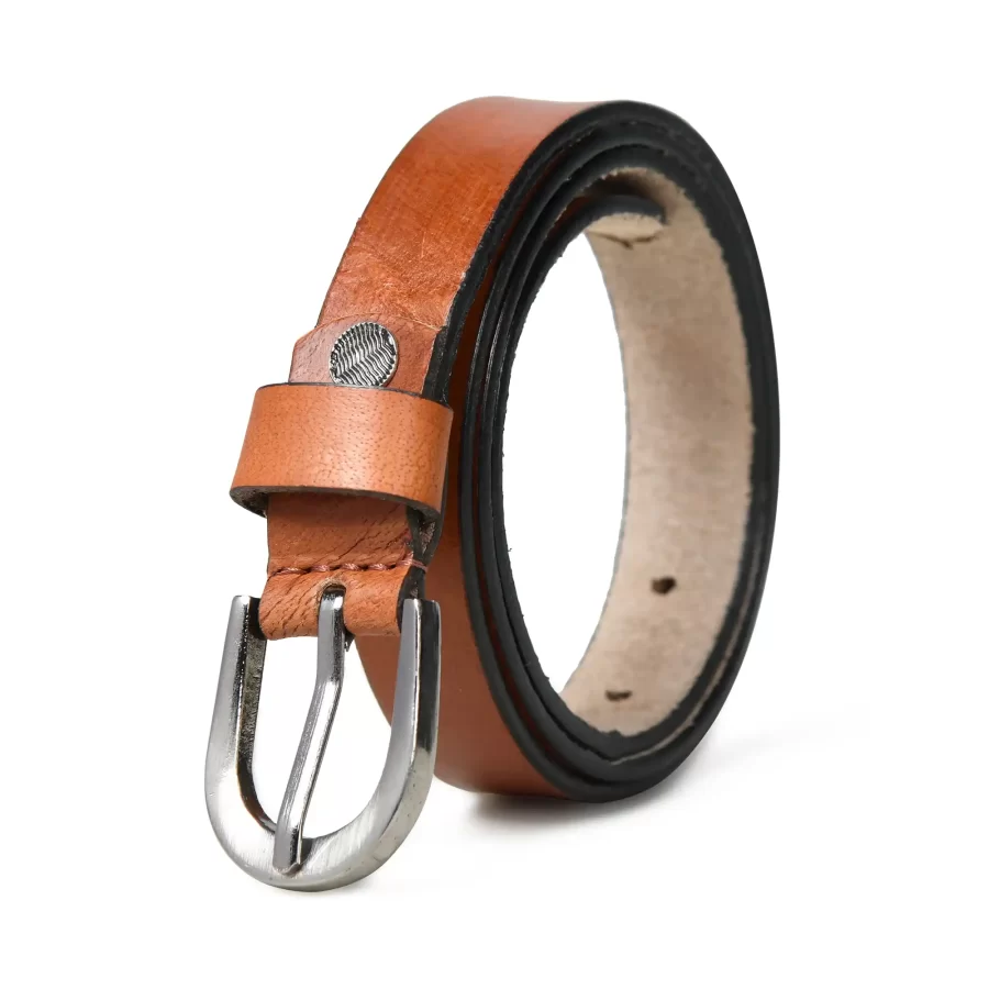 Light brown leather belt rolled up with the front side and buckle visible